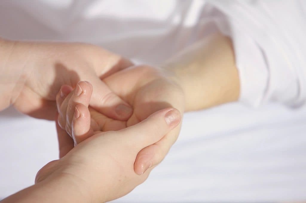 Giving hand massage photo